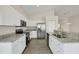 Modern kitchen with stainless steel appliances and granite countertops at 6978 Superior Street Cir, Sarasota, FL 34243