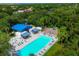 Aerial view of community pool, surrounded by lush landscaping at 6978 Superior Street Cir, Sarasota, FL 34243