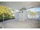 Screened patio area with table and chairs, near the pool at 6978 Superior Street Cir, Sarasota, FL 34243