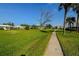 Neatly landscaped community featuring a walking path and lush green lawns at 7003 9Th W Ave, Bradenton, FL 34209