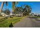 Residential street with mature trees and well-maintained lawns at 7003 9Th W Ave, Bradenton, FL 34209