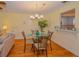 Small dining area with glass-top table and four chairs at 7003 9Th W Ave, Bradenton, FL 34209