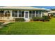 Home with screened patio and lush landscaping at 7003 9Th W Ave, Bradenton, FL 34209