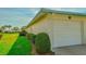 Single car garage with grassy yard at 7003 9Th W Ave, Bradenton, FL 34209