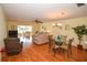 Bright and airy living room with hardwood floors and comfy seating at 7003 9Th W Ave, Bradenton, FL 34209