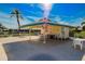 Relaxing poolside patio with tables and chairs under a covered area at 7003 9Th W Ave, Bradenton, FL 34209