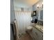 Bathroom with a shower/tub, toilet and vanity at 7309 Royal Palm Dr, New Port Richey, FL 34652