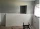 Unfinished spare bedroom with new wainscoting at 7309 Royal Palm Dr, New Port Richey, FL 34652