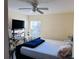 Bedroom with queen-size bed and window at 7615 River Oak Run # 103, Lakewood Ranch, FL 34202