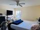 Bedroom with queen-size bed and a bicycle at 7615 River Oak Run # 103, Lakewood Ranch, FL 34202