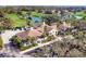 Beautiful clubhouse featuring lush landscaping, golf course views, and elegant architecture at 8729 52Nd E Dr, Bradenton, FL 34211