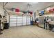 Spacious garage with ample storage, epoxy flooring, and organized shelving for all your needs at 8729 52Nd E Dr, Bradenton, FL 34211