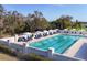 Relaxing pool area with lounge chairs and umbrellas for residents to enjoy the Florida sunshine at 8729 52Nd E Dr, Bradenton, FL 34211