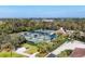 The aerial view shows well-maintained tennis courts within a lush, landscaped community at 8729 52Nd E Dr, Bradenton, FL 34211