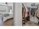 Walk-in closet featuring ample storage, shelving, and organization system at 8755 Olde Hickory Ave # 7302, Sarasota, FL 34238