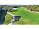 Expansive view of the meticulously maintained golf course with mature trees at 8755 Olde Hickory Ave # 7302, Sarasota, FL 34238