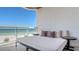 Relax on this spacious balcony with a daybed, enjoying stunning views of the beach and ocean at 1035 Seaside Dr # 503, Sarasota, FL 34242