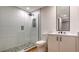 Elegant bathroom featuring a large, glass shower with pebble flooring and modern sink at 1035 Seaside Dr # 503, Sarasota, FL 34242