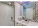 Beautiful bathroom features a mosaic ceiling, large mirror and a walk-in shower at 1035 Seaside Dr # 503, Sarasota, FL 34242