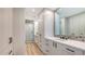 Modern bathroom with walk-in shower, custom cabinets, and stylish decor at 1035 Seaside Dr # 503, Sarasota, FL 34242