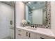 Beautiful bathroom with a walk-in shower and designer mirror at 1035 Seaside Dr # 503, Sarasota, FL 34242