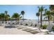 Picturesque beachside lounging area with comfortable seating and serene ocean views at 1035 Seaside Dr # 503, Sarasota, FL 34242