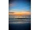 Scenic beach view at sunset with calm waters and colorful sky, offering a tranquil coastal vista at 1035 Seaside Dr # 503, Sarasota, FL 34242