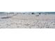 Expansive view of the beach showing white sands and light crowds at 1035 Seaside Dr # 503, Sarasota, FL 34242