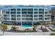 Beautiful exterior shot of a beachfront condominium showcasing multiple floors and expansive balconies with ocean views at 1035 Seaside Dr # 503, Sarasota, FL 34242