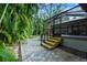 Wooden steps leading to a screened patio at 1155 Hampton Rd, Sarasota, FL 34236