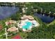 Aerial view of community pool, playground, and tennis courts at 12823 Penguin Dr, Bradenton, FL 34212