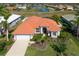 Aerial view of single-Gathering home with pool and landscaped yard at 12823 Penguin Dr, Bradenton, FL 34212