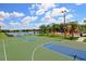 Community basketball court with two hoops at 12823 Penguin Dr, Bradenton, FL 34212