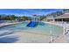 Fun kiddie pool with a small slide and water features at 12823 Penguin Dr, Bradenton, FL 34212