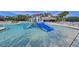 Kiddie pool with a blue slide and water features at 12823 Penguin Dr, Bradenton, FL 34212