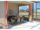 Covered patio with dining area and sheer curtains at 12823 Penguin Dr, Bradenton, FL 34212