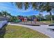 Colorful playground with slides, climbing structures, and swings for children at 12823 Penguin Dr, Bradenton, FL 34212