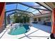 Expansive pool area with covered patio and seating at 12823 Penguin Dr, Bradenton, FL 34212