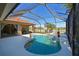 Screened pool and spa with waterfall feature at 12823 Penguin Dr, Bradenton, FL 34212