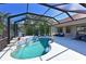 Enjoy this relaxing pool and lanai with tiled water features at 12823 Penguin Dr, Bradenton, FL 34212