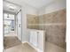 Modern bathroom with frameless glass shower and neutral tile at 13922 Old Creek Ct, Parrish, FL 34219