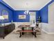 Chic dining room featuring bold blue walls and stylish decor at 13922 Old Creek Ct, Parrish, FL 34219