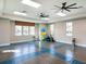 Bright fitness room with exercise equipment and ample space for workouts at 13922 Old Creek Ct, Parrish, FL 34219