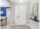 Inviting foyer with view into dining room, featuring tile floors and decorative accents at 13922 Old Creek Ct, Parrish, FL 34219