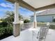 Relaxing covered porch with rocking chairs offering a lovely view of the neighborhood at 13922 Old Creek Ct, Parrish, FL 34219