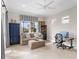 Inviting living room area with a large window, comfortable seating, and built-in shelving at 13922 Old Creek Ct, Parrish, FL 34219