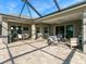 Spacious screened patio with comfortable seating, ideal for relaxing and enjoying the outdoor living space at 13922 Old Creek Ct, Parrish, FL 34219