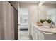 Bathroom with double sinks and a view to the bedroom, creating a seamless transition at 14180 Crimson Ave, Bradenton, FL 34211