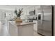 Modern kitchen with stainless steel appliances, granite countertops, and white cabinetry, offering style and functionality at 14180 Crimson Ave, Bradenton, FL 34211