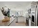 Open kitchen layout with granite counters, stainless steel appliances, and white cabinetry, perfect for modern living at 14180 Crimson Ave, Bradenton, FL 34211